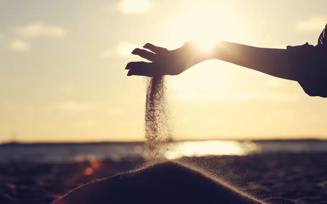Beach Sand Falling Through Fingers